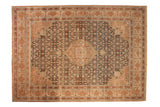 Distressed vintage Sivas carpet with a central medallion, charcoal Herati design, and warm blush tones.