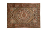 Vintage distressed Persian Bakhtiari rug with a central stepped medallion in brick red, ivory, and powder blue.