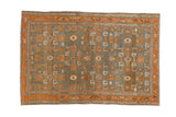 Vintage Persian Mehreban rug with a distressed geometric Herati design in sky blue and terracotta.
