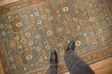 Distressed low pile and geometric Herati design of a vintage Persian Mehreban rug.