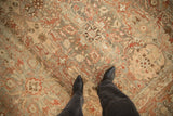 Detailed view of the even wear and hand-knotted texture on a vintage distressed Malayer carpet.