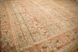 Prominent color abrashes in rose, silver, and beige across a distressed vintage Malayer carpet.