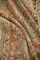 Detailed texture of the vintage Malayer rug's low pile with even wear across the knots.