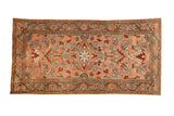 Vintage distressed Lilihan runner with a central starburst medallion in blush, slate blue, and pomegranate red.