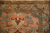 Intricate floral border and field detail in slate blue, blush, and pomegranate red.
