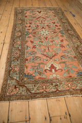 Angled perspective of a vintage Lilihan runner's floral design in blush, terracotta, and slate blue.