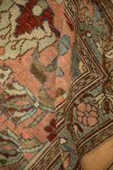 The soft, worn pile of a vintage Lilihan rug with blush and slate blue floral motifs.
