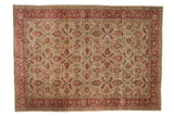 Vintage Sivas carpet with an allover lotus and palmette pattern in raspberry red and blush on a beige field.