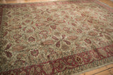 Angled view of a vintage Sivas carpet highlighting its low pile and allover floral pattern.