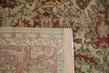 Hand-knotted back and low pile of a vintage Sivas carpet in raspberry and beige.