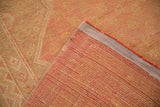 Hand-knotted foundation and secured side of the vintage Turkish Oushak, revealing distressed rose and gold pile.