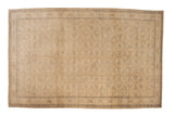 Distressed Kayseri carpet with an allover floral field and turtle samovar border in neutral tones.