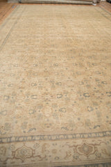 Low angle view of the distressed Kayseri carpet showing its textured floral field and samovar border.