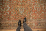Low-pile texture and intricate border detail of a distressed vintage Persian Mahal carpet.
