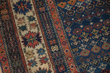 Detailed view of crab style main border and geometric field on antique Caucasian rug.