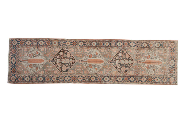 Vintage distressed Bakhtiari runner with charcoal, tangerine, oxidized silver, cobalt blue patterns, 2'8" x 10'2".