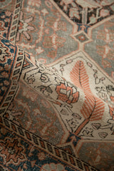 Vintage Distressed Bakhtiari rug pile revealing faded cypress motifs in charcoal, tangerine, and ivory.