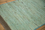 Soft, plush abrashed powder blue pile, corded selvage, and rug foundation view.
