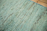 Soft, plush wool pile with abrashed powder blue, silver, and charcoal striations.