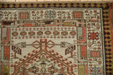 Distressed Serab runner corner with madder red, pale blue geometric guls and pawn border.