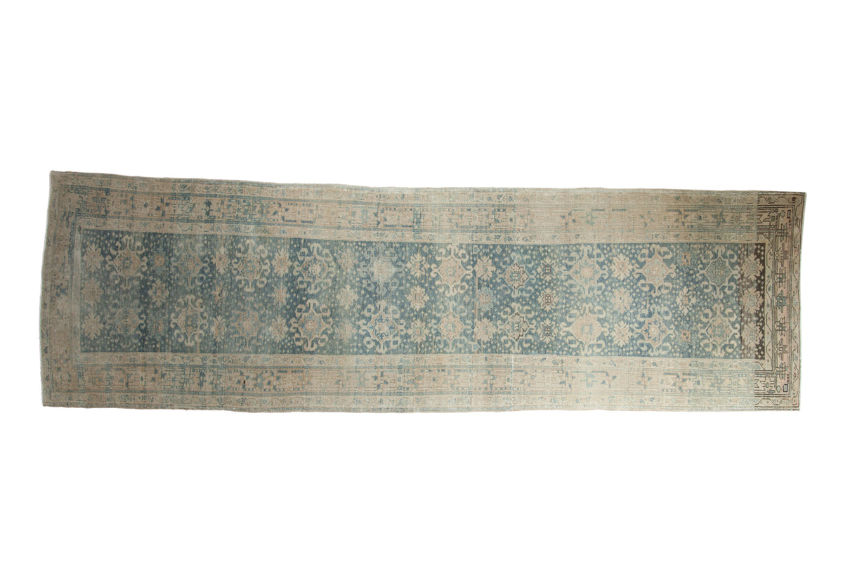 Distressed Bijar runner with faded pale blue, ivory floral guls, and soft worn pile, 3'7" x 11'9".