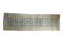 Distressed Bijar runner with faded pale blue, ivory floral guls, and soft worn pile, 3'7" x 11'9".