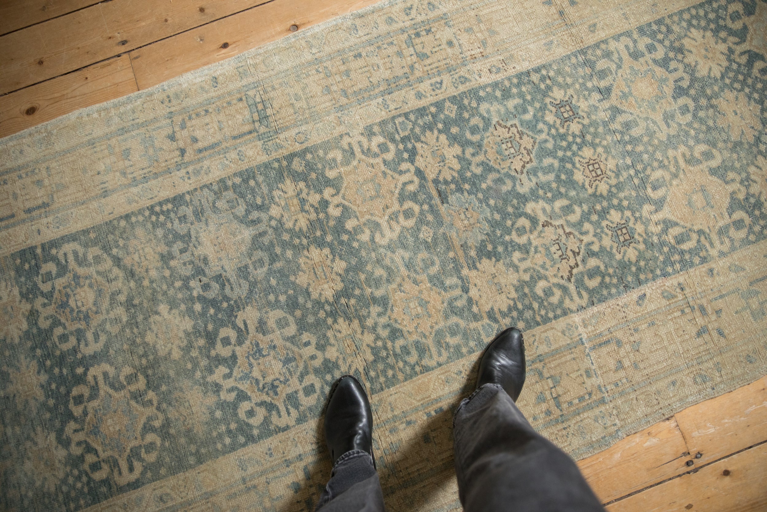 Distressed Vintage Bijar runner with pale blue and ivory floral guls, displaying low pile wear.