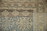 Distressed Bijar runner corner with floral guls, starburst, barber-pole in blue, beige.