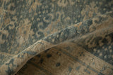 Distressed Vintage Bijar rug's worn pile texture revealing denim blue and beige tones.