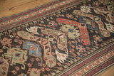 Antique Caucasian Soumac runner detail: chocolate brown field, beige, red, sapphire blue arabesques.
