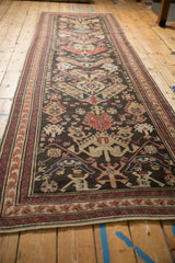 Antique Soumac runner, intricate flatweave texture with chocolate, red, blue germinating designs.