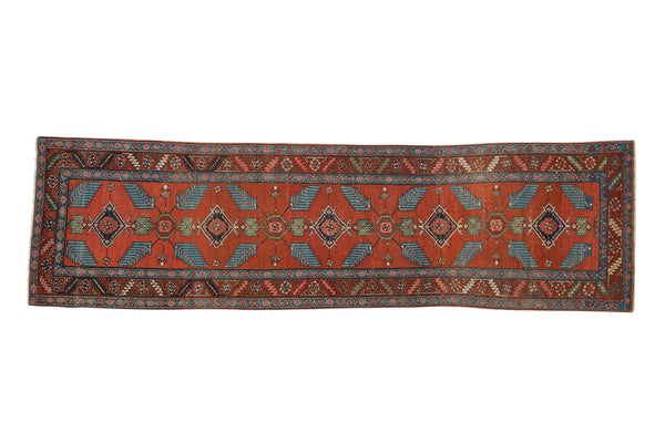 Antique Northwest Persian runner, blue finned leaves and florals on rich red, circa 1910s.