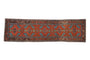 Antique Northwest Persian runner, blue finned leaves and florals on rich red, circa 1910s.