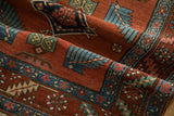 Detail of antique Persian runner's hand-knotted pile, showing finned leaves in rust and sky blue.