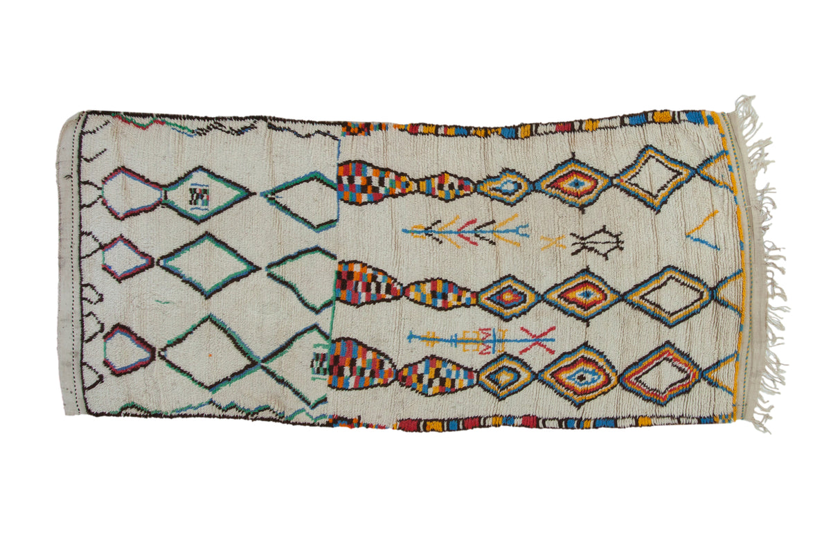 Vintage 1980s Moroccan rug runner, ivory field, abstract diamonds and playful motifs in vibrant hues.