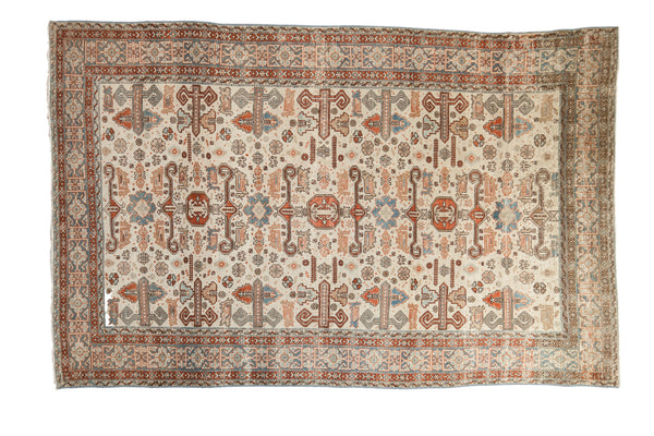 Distressed Persian Ardebil rug with allover Perpedil design in ivory, terra cotta, and slate blue.