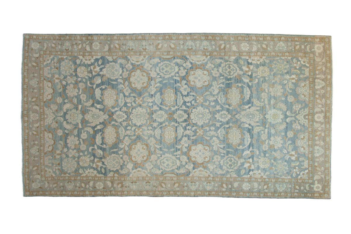 Distressed vintage Tabriz carpet with an abrashed dusty sky blue ground and Herati floral patterns, 5'6" x 10'4".