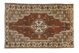 Vintage Distressed Mazlaghan rug featuring shield medallion, abrashed brown and silver tones.