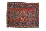 Hand-knotted vintage Karaja rug, brick red field, navy medallion, geometric florals, Herati border.