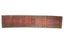 Collectible antique Northwest Persian runner: cherry red field, stepped medallions, floral borders.