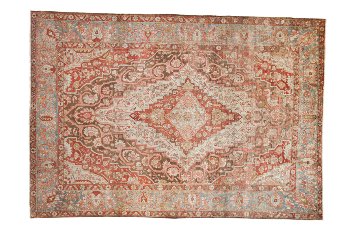Antique Distressed Sarouk carpet, ruby red field, central medallion, and blue borders.