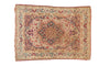 Antique Kerman square rug, concentric floral medallion, book cover spandrels, ivory, navy, red.