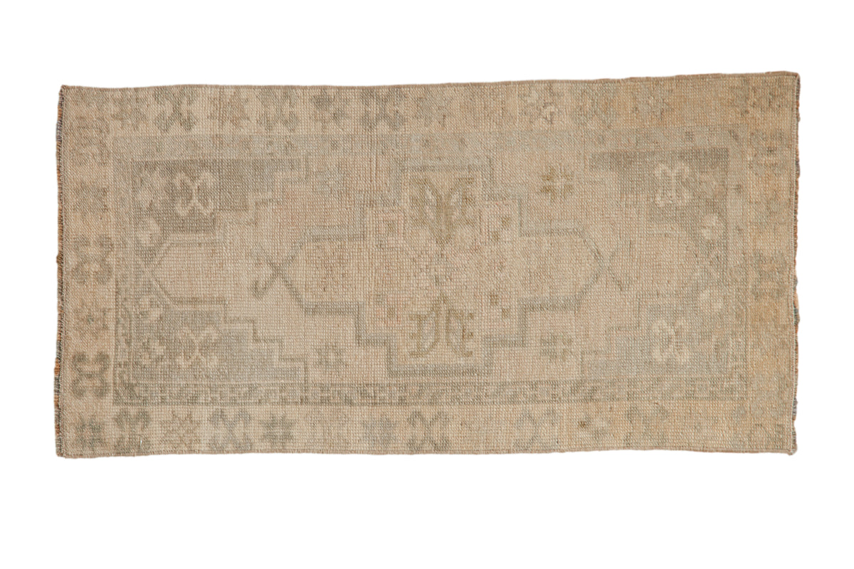 Distressed Oushak rug mat runner with faded ivory and silver tones, subtle floral motif.