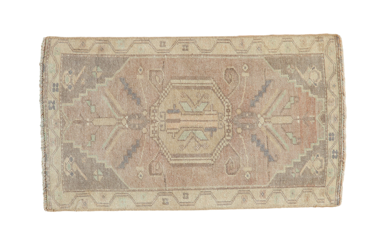 Distressed Oushak rug mat with faded mauve, sand, pale blue geometric medallion, 1'7" x 2'9".