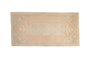 Distressed Oushak mat runner with triple medallions in faded cantaloupe, ivory, and silver tones.