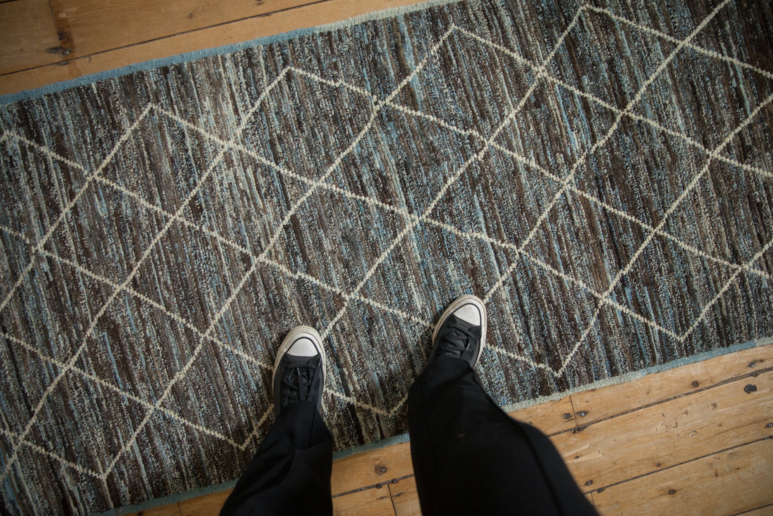Overdyed Pakistani Moroccan runner, abrashed charcoal and blue field, geometric trellis.