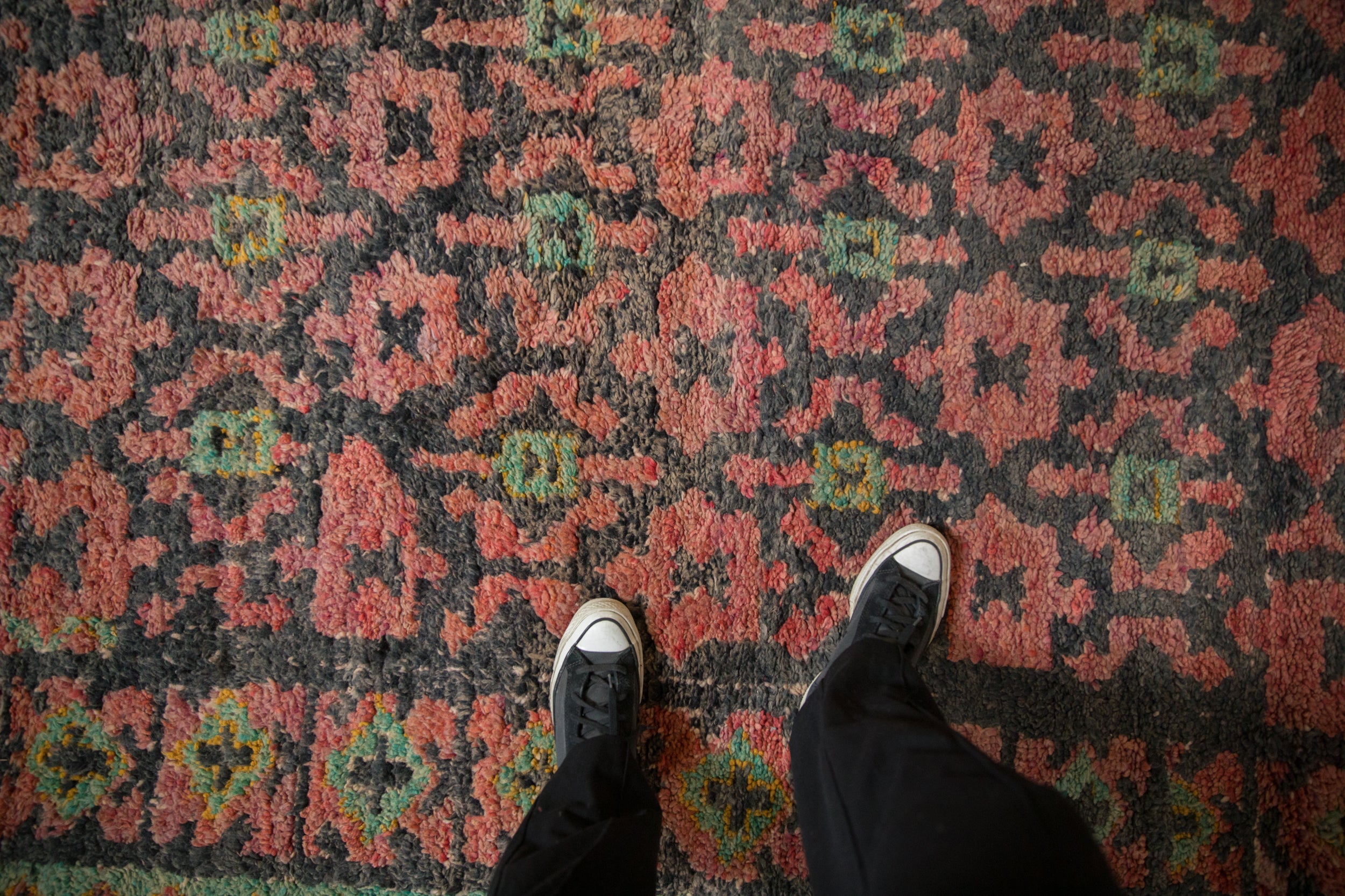 Vintage Moroccan rug's thick pile, raspberry and deep ink blue minor starbursts.
