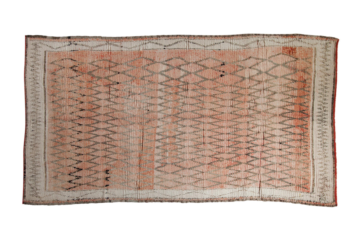 Vintage Moroccan carpet with diamond pattern, faded rose, silver, and ivory tones, 5'11" x 10'9".