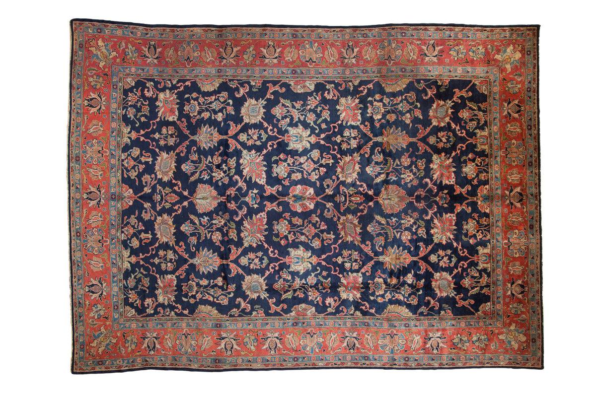 Vintage Lilihan carpet: dark navy field, allover palmette lattice, madder root border, 8'11" x 11'10".