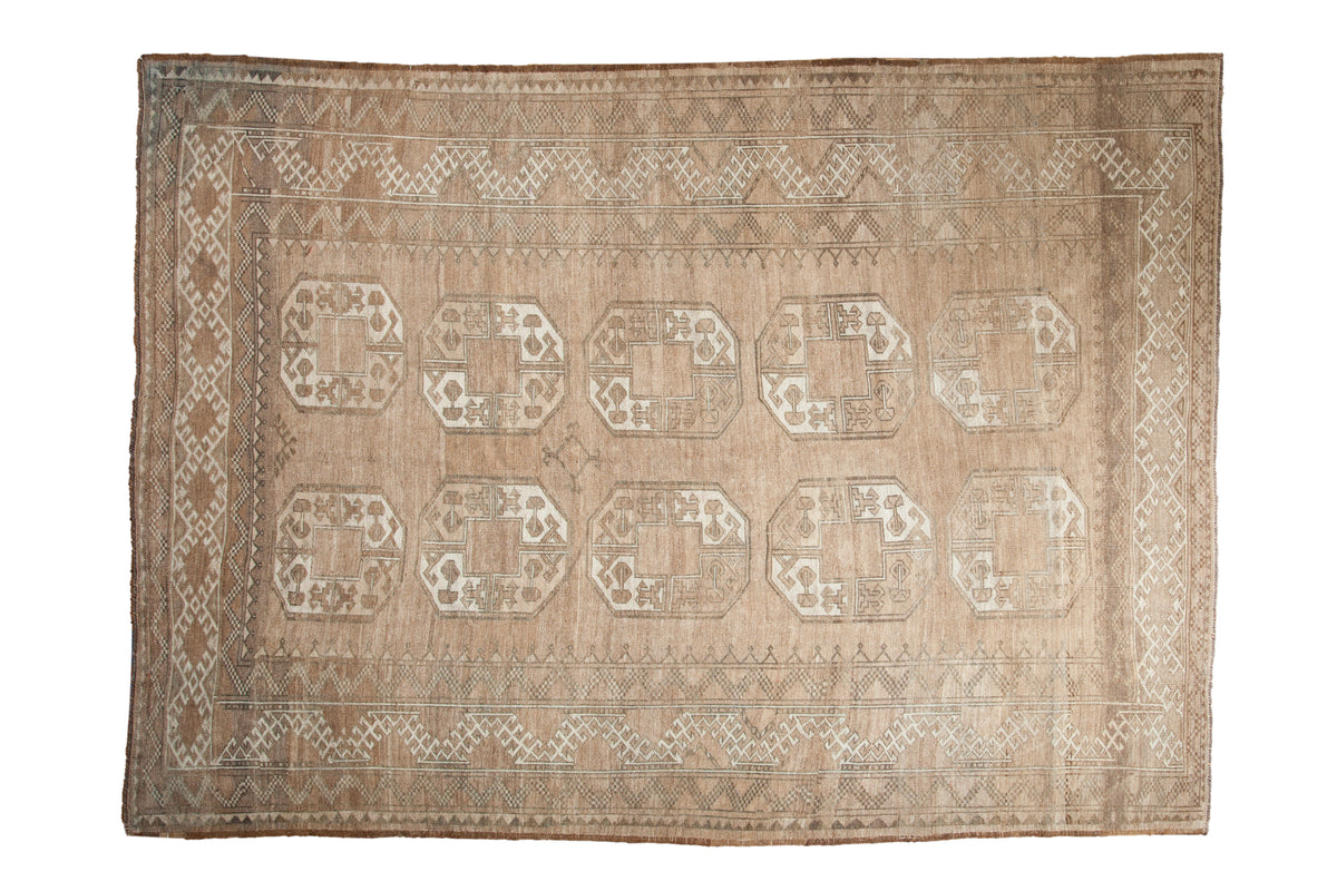 Vintage distressed Ersari carpet with octagonal floral guls, abrashed beige, ivory, and geometric borders, 6'11" x 9'7".